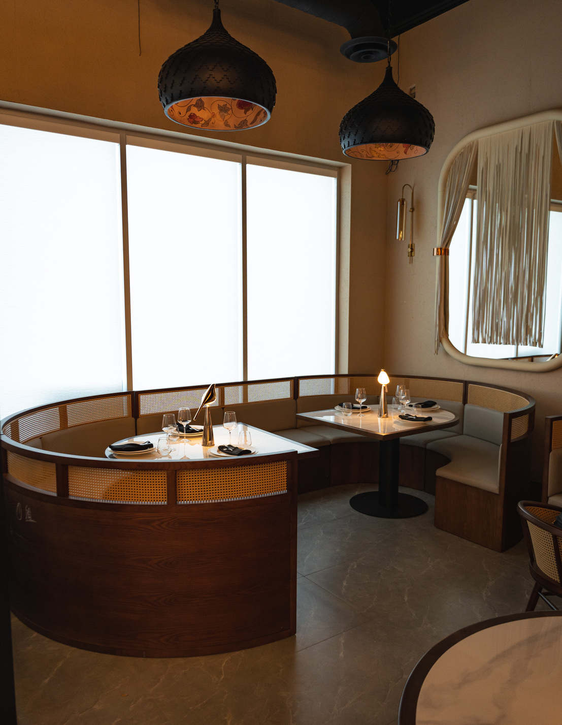 Curved booths by the windows